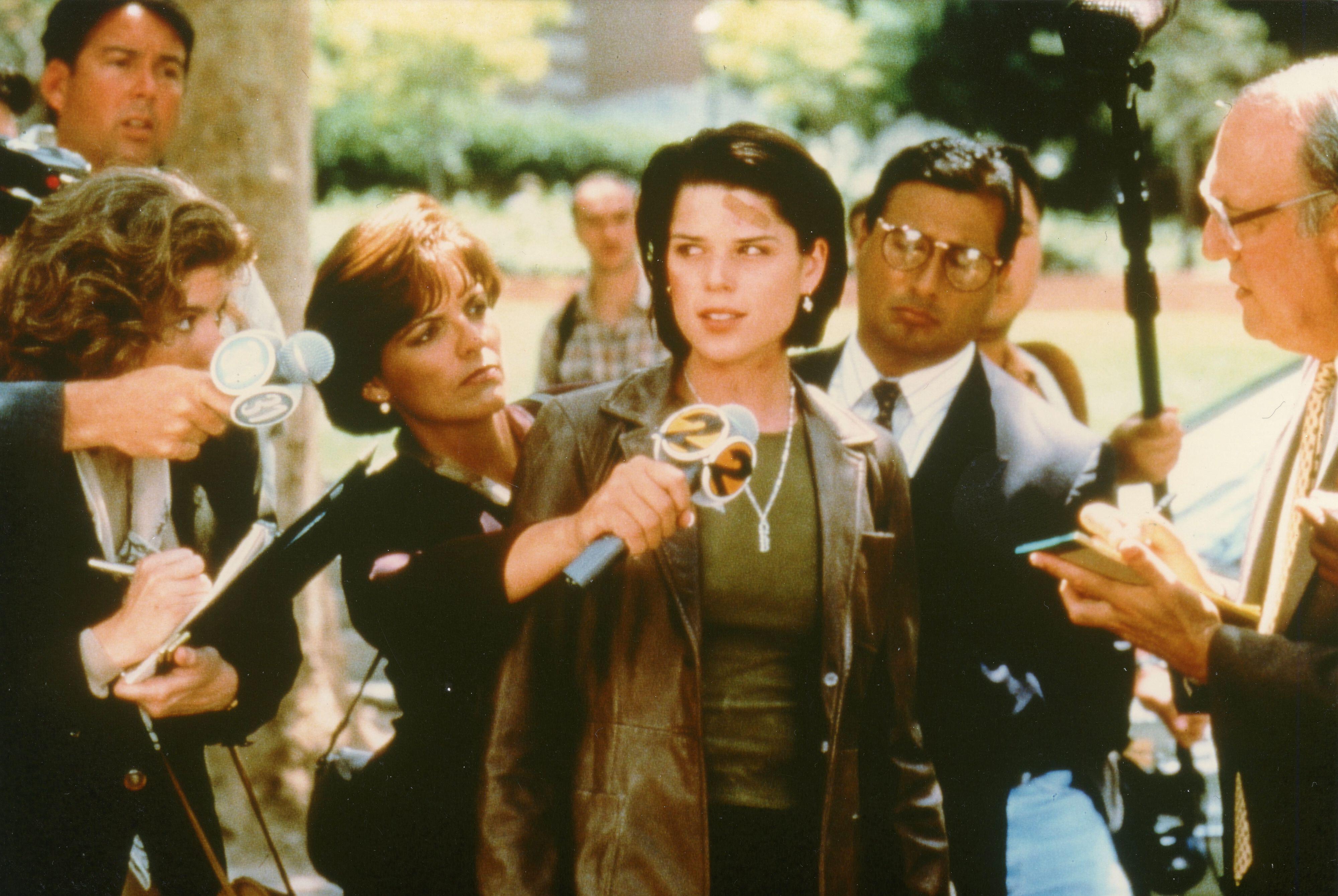 Neve Campbell (as Sidney Prescott) speaking to reporters in the film Scream 2