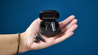 A pair of EarFun Air Pro 3 wireless earbuds sitting in a person's palm