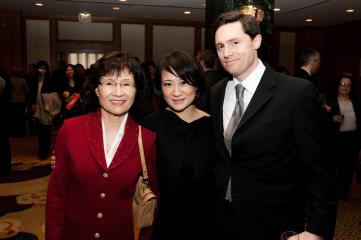 257368-Wonder_Woman_Michelle_Kim_group_VP_and_chief_counsel_programming_Time_Warner_Cable_stands_between_the_two_loves_of_her_life_0.jpg