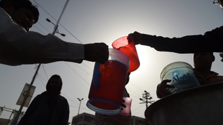 Residents in Karachi receive water in heatwave