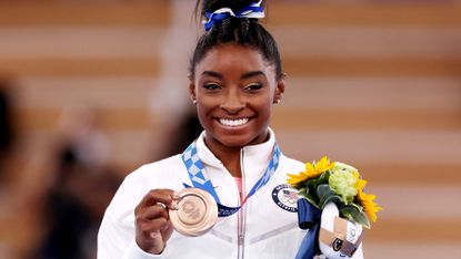 tokyo, japan august 03 simone biles of team united states poses with the bronze medal during the womens balance beam final medal ceremony on day eleven of the tokyo 2020 olympic games at ariake gymnastics centre on august 03, 2021 in tokyo, japan photo by jamie squiregetty images