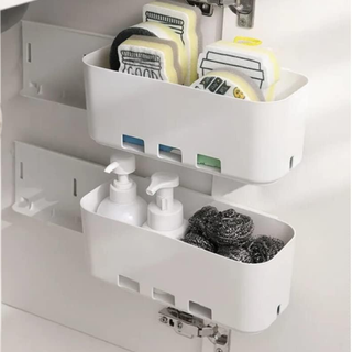 A wall-mount pull out drawer under a sink