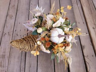 Colorful Thanksgiving cornucopia in woven horn with gourds