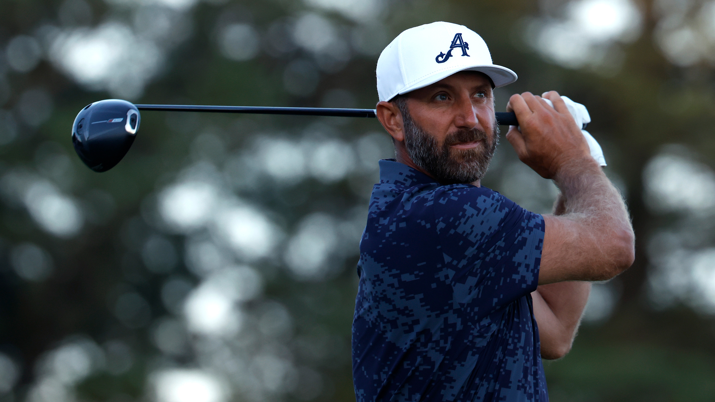 Dustin Johnson holds his finish on a drive