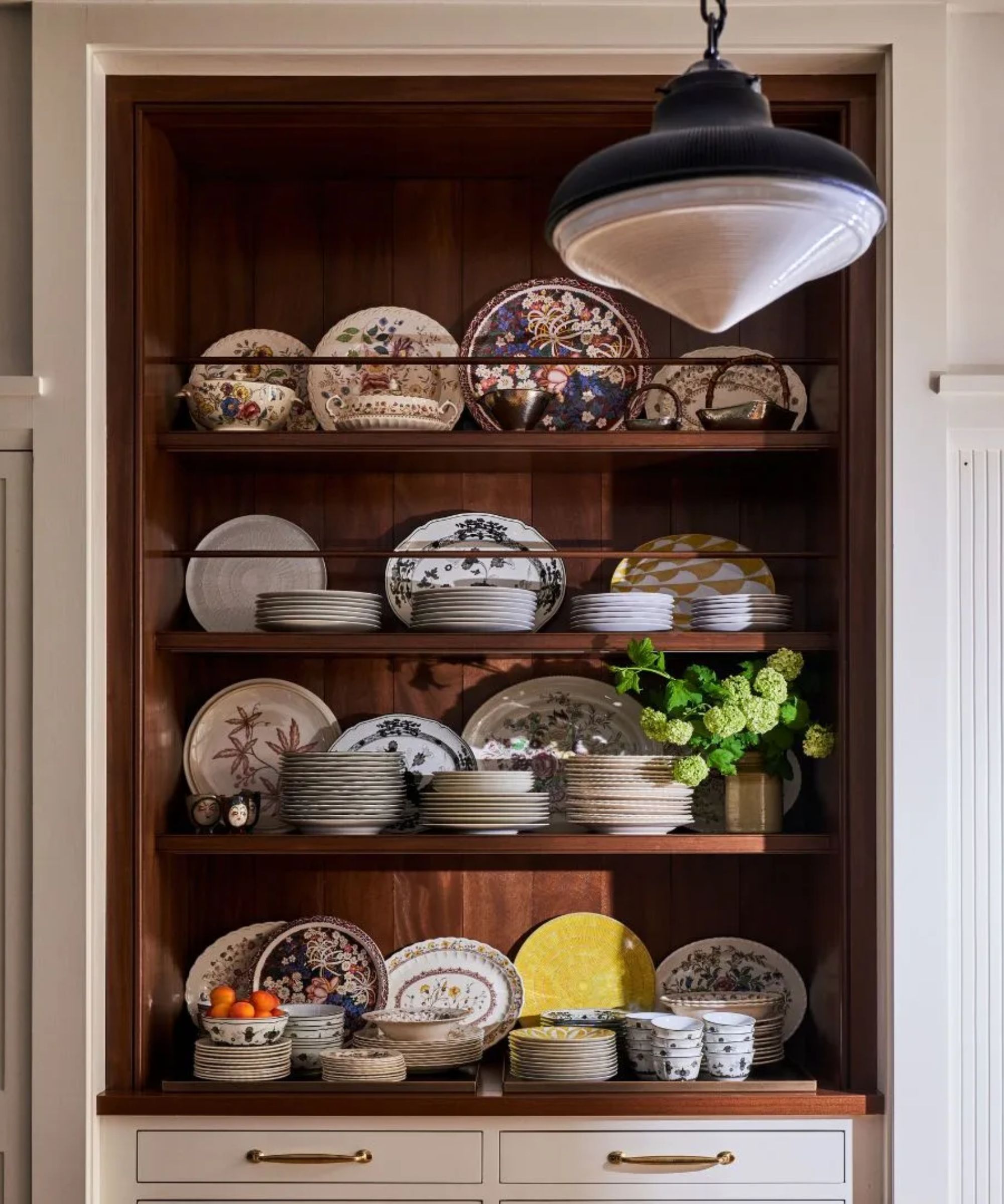 Wooden shelf decorated with plates