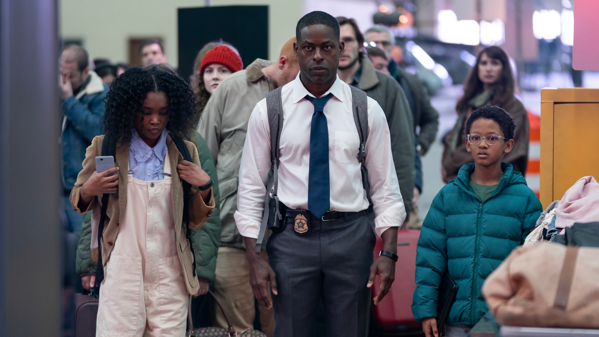 Xavier walks beside his kids in Paradise season 1