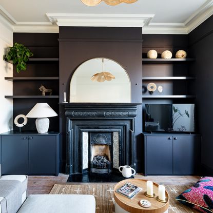 living room with black painted cabinetry and fireplace