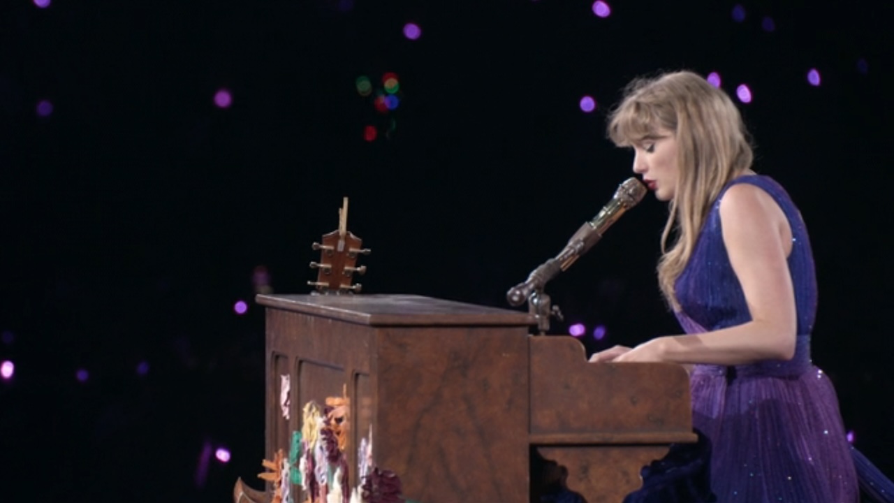 Profile of Taylor Swift playing piano at The Eras Tour