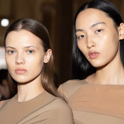 Models backstage at fashion week