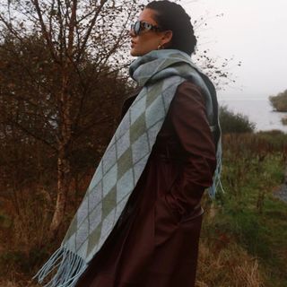 tried and tested gifts woman wearing green blue and grey diamond print scarf