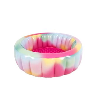A pink multicolored inflatable pool
