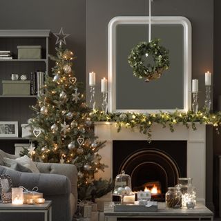 Grey Christmas living room with Christmas wreath and tree