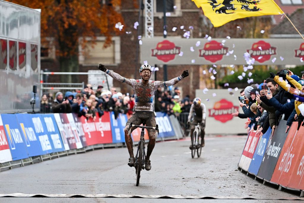 OVERIJSE BELGIUM NOVEMBER 20 Michael Vanthourenhout of Belgium and Team Pauwels Sauzen Bingoal celebrates at finish line as race winner ahead of Thomas Pidcock of United Kingdom and Team INEOS Grenadiers during the 62nd UCI Cyclocross World Cup Druivencross Overijse 2022 Mens Elite CXWorldCup Overijse Cyclocross on November 20 2022 in Overijse Belgium Photo by Luc ClaessenGetty Images
