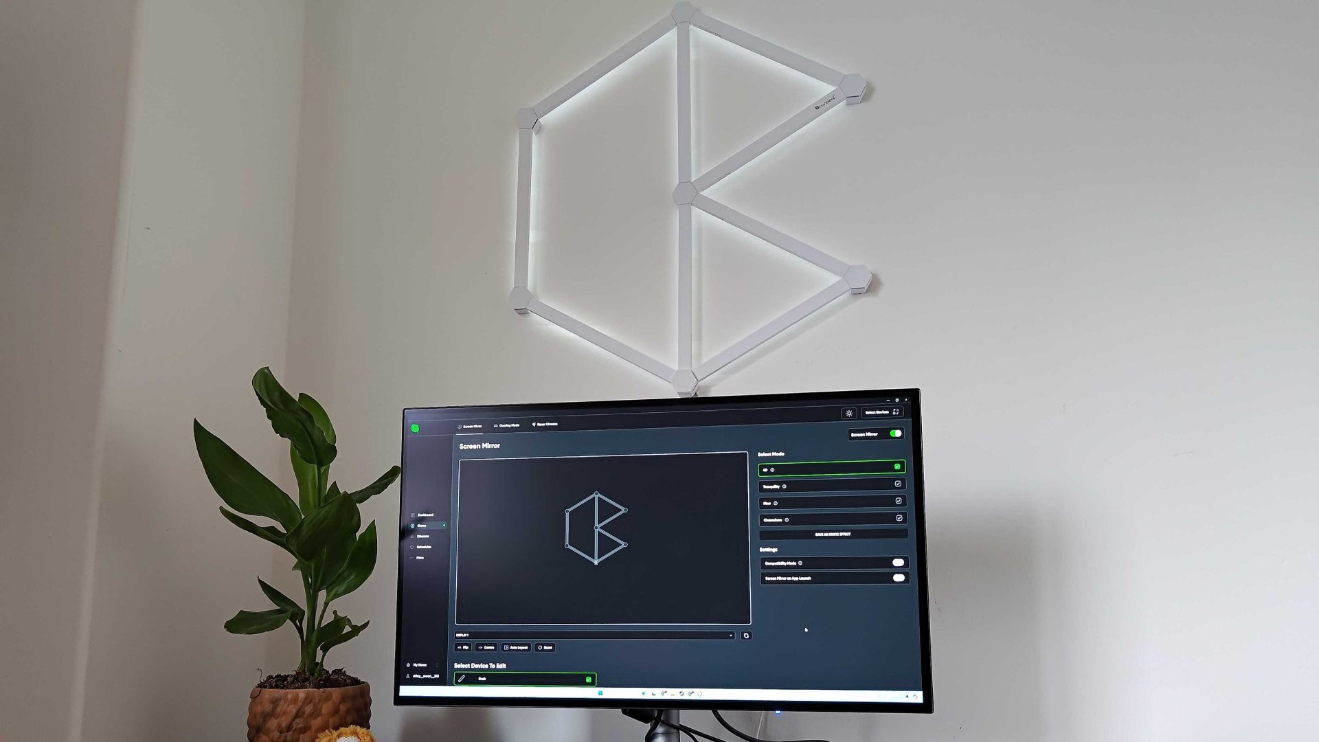 Nanoleaf Lines kit illuminated with app on screen