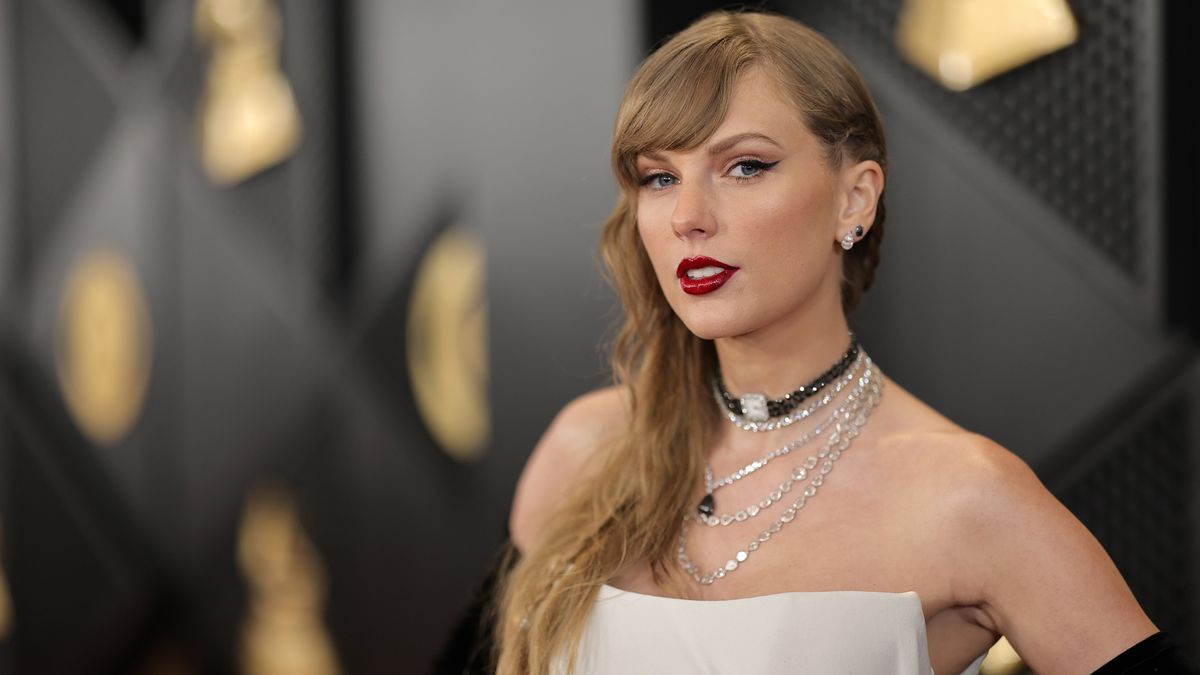 A close up shot of Taylor Swift on the 2024 Grammys red carpet