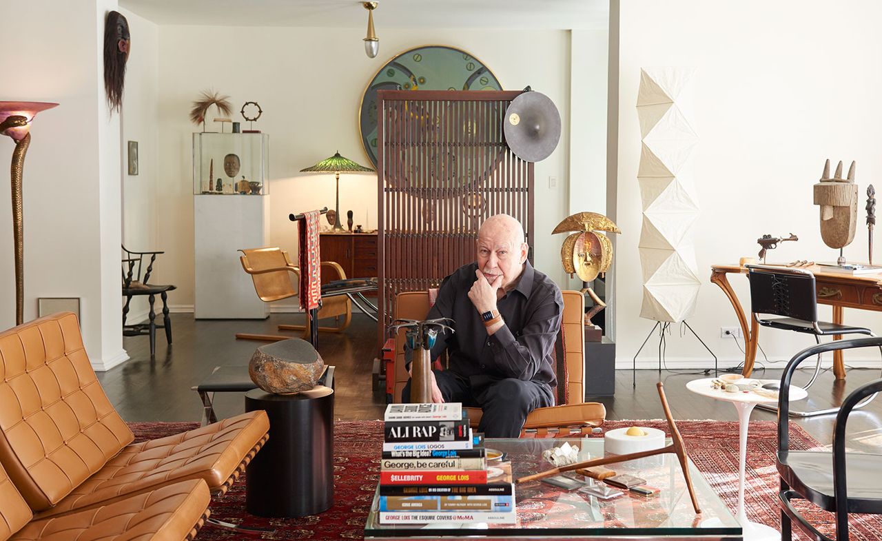 George Lois, trying out the Apple Watch Hermès, surrounded by his design collection in his New York apartment.