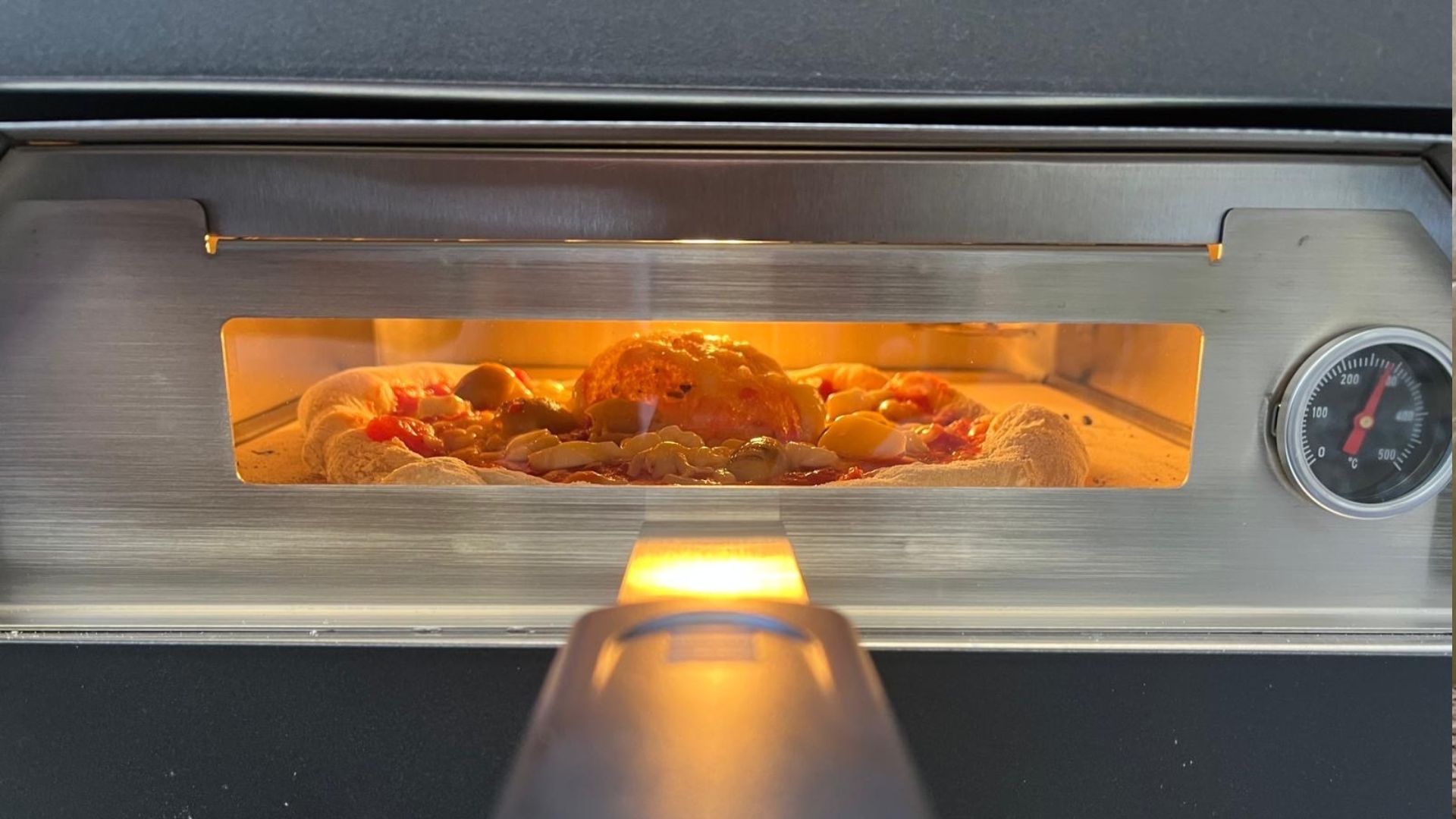 The Firebloom EP03 Electric Pizza Oven being tested in a courtyard