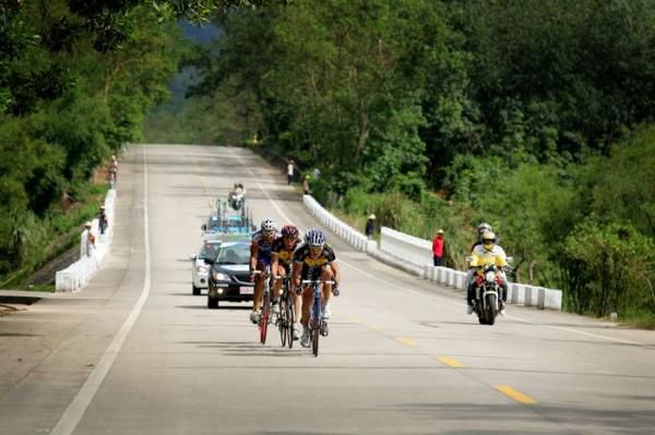 The riders rode through tropical vegetation during stage 1.