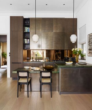 Kitchen with wooden cabinets and bar stools