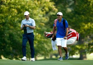 rory mcilroy shoots three under with new caddie