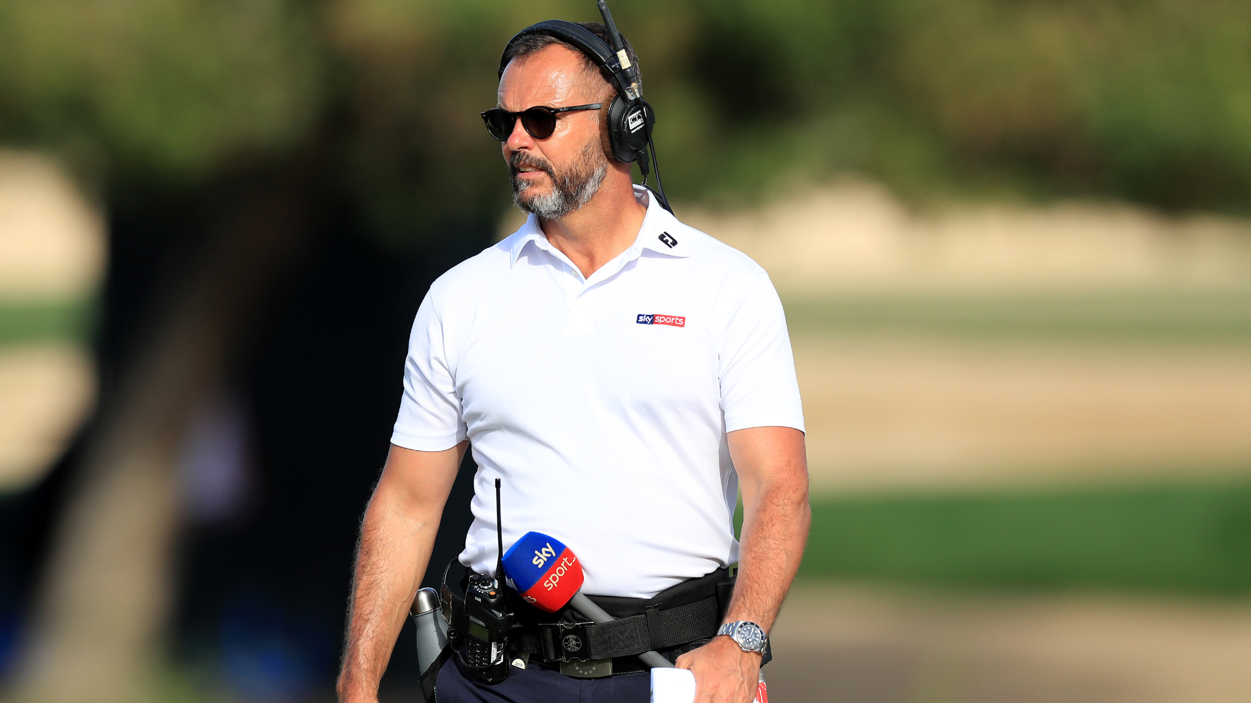 Andrew Coltart working at the Dubai Desert Classic