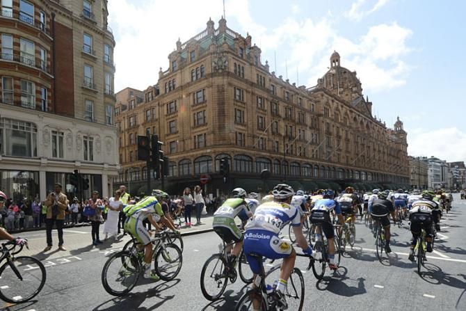 The group riding past Harrods in London