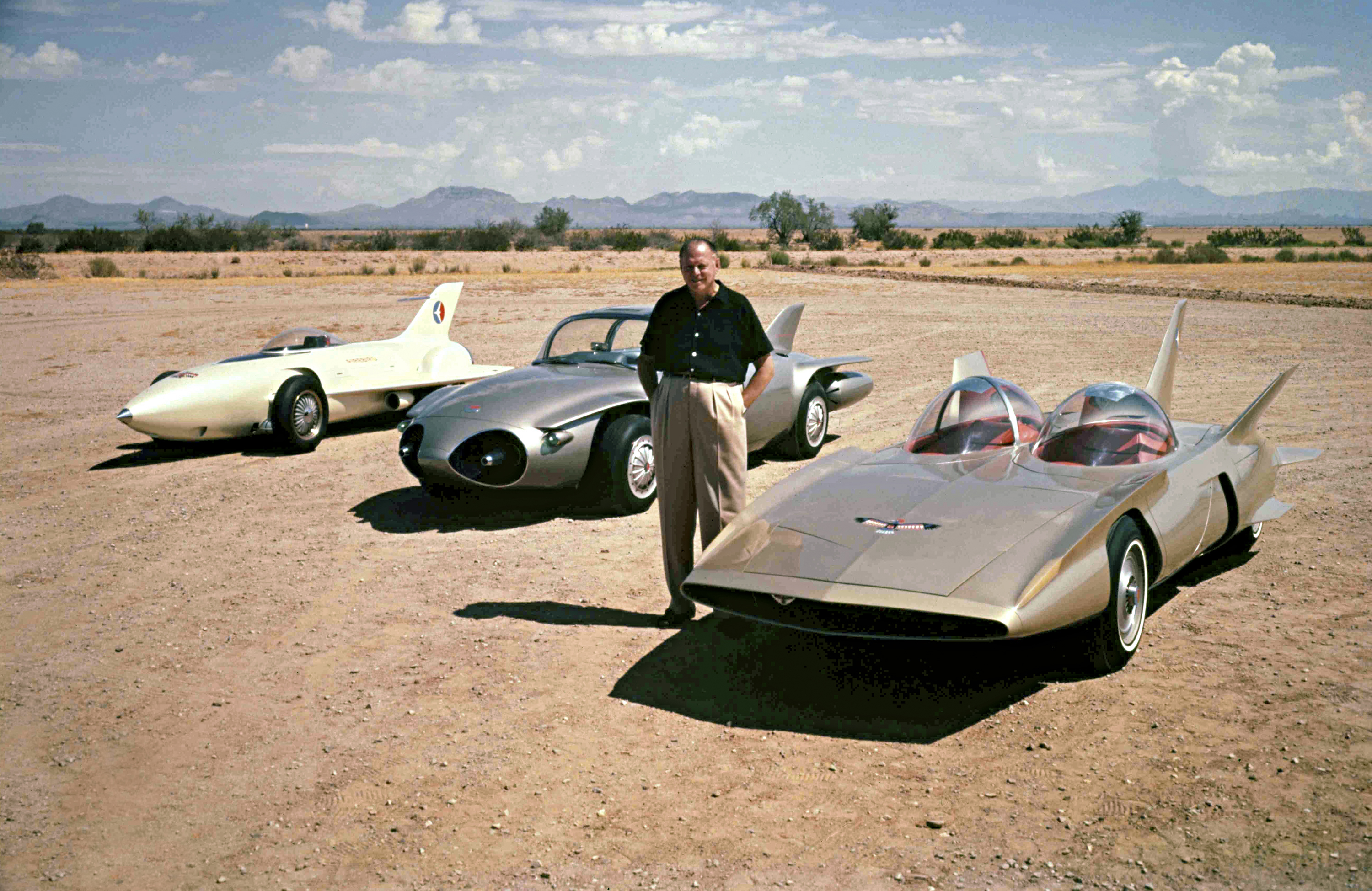 Former GM design chief Harley Earl with (from left) the Firebird I, II, and III concept cars, 1959