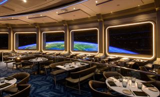 As a restaurant in geosynchronous orbit, the rotation of the planet is not seen out the windows. The view is not static, though, based on when and what time of day guests dine.