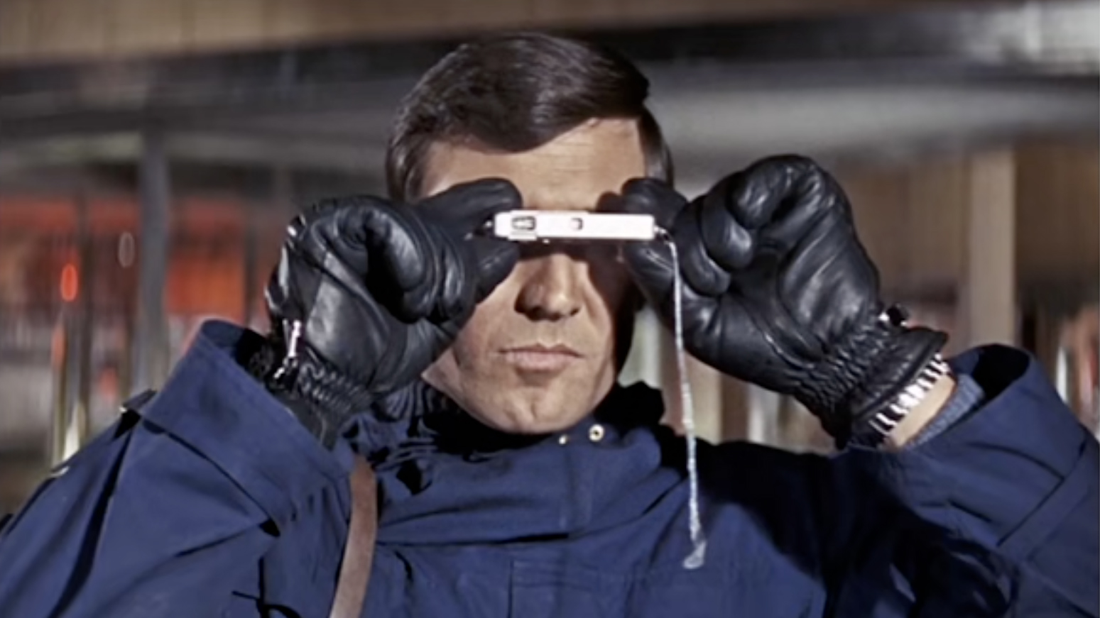 James Bond using a Minox 8x11 camera in On Her Majesty&#039;s Secret Service