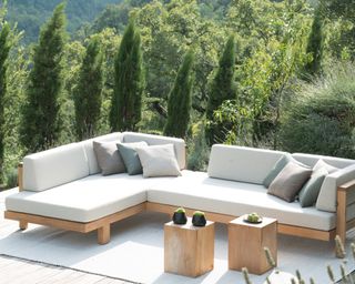 wooden outdoor corner sofa with cream sofa cushions