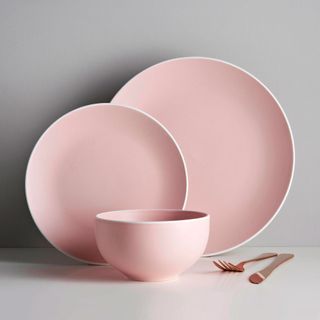 bluish pink tableware with plates fork and bowl