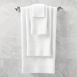 Frontgate Resort Collection Bath Towels in white, hanging on a bathroom wall.
