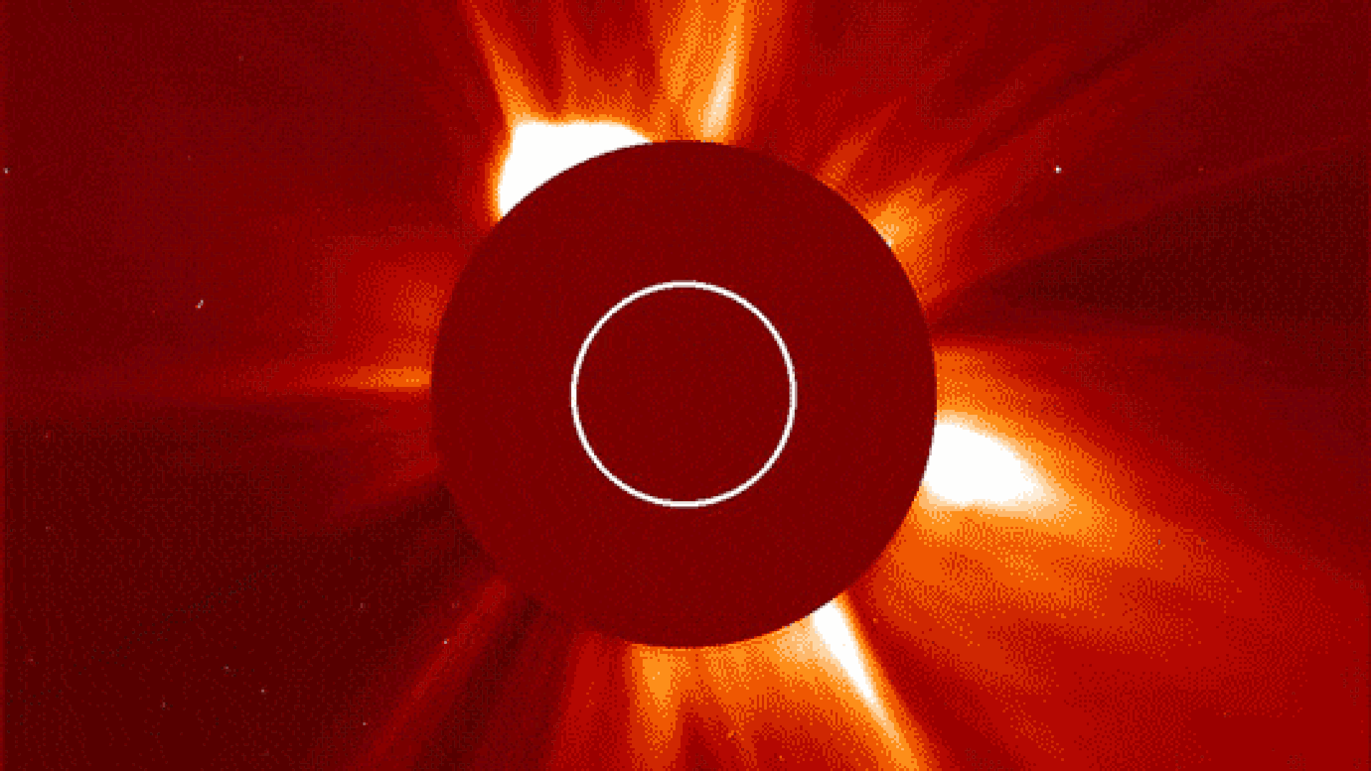 A red screen showing a circle in the center and a blast of light comes out the top left.