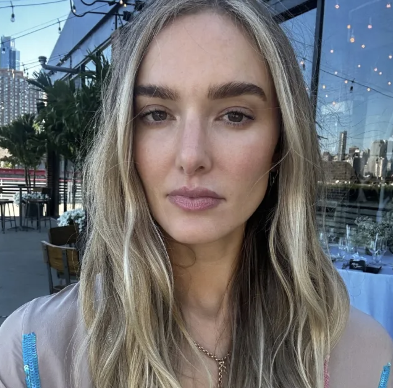 a woman with blonde hair after using the Illia skin tint.