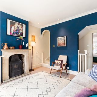 interior arches with blue wall and fireplace