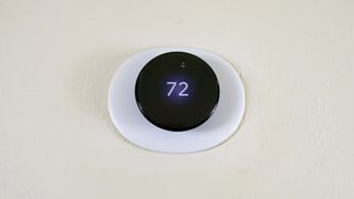 The Nest Learning Thermostat (4th Gen) on a wall