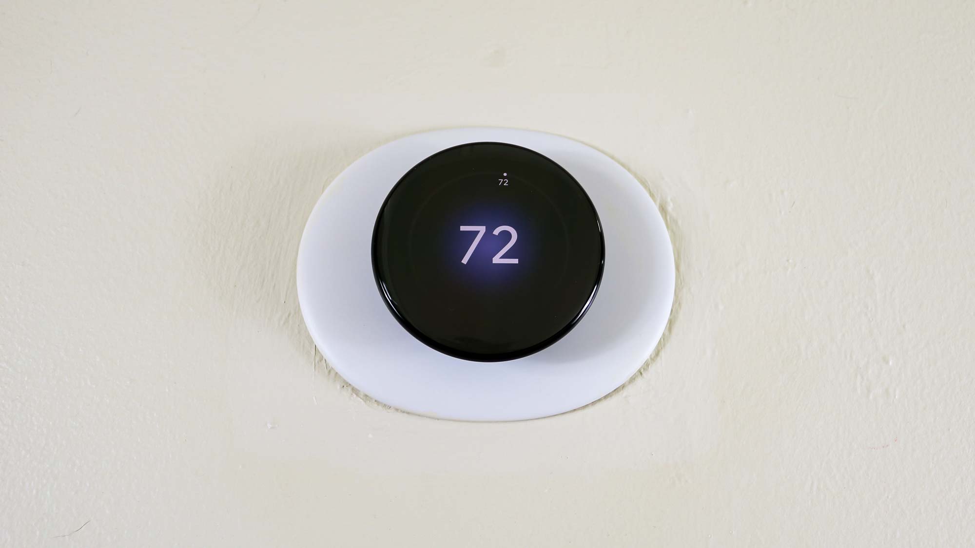 The Nest Learning Thermostat (4th Gen) on a wall