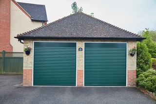 Green roller garage door on double garage