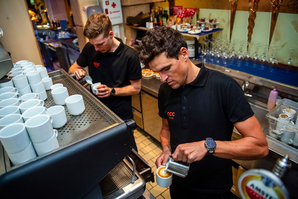 Greg Van Avermaet and Gijs Van Hoecke work the espresso machine at the CCC Team press conference