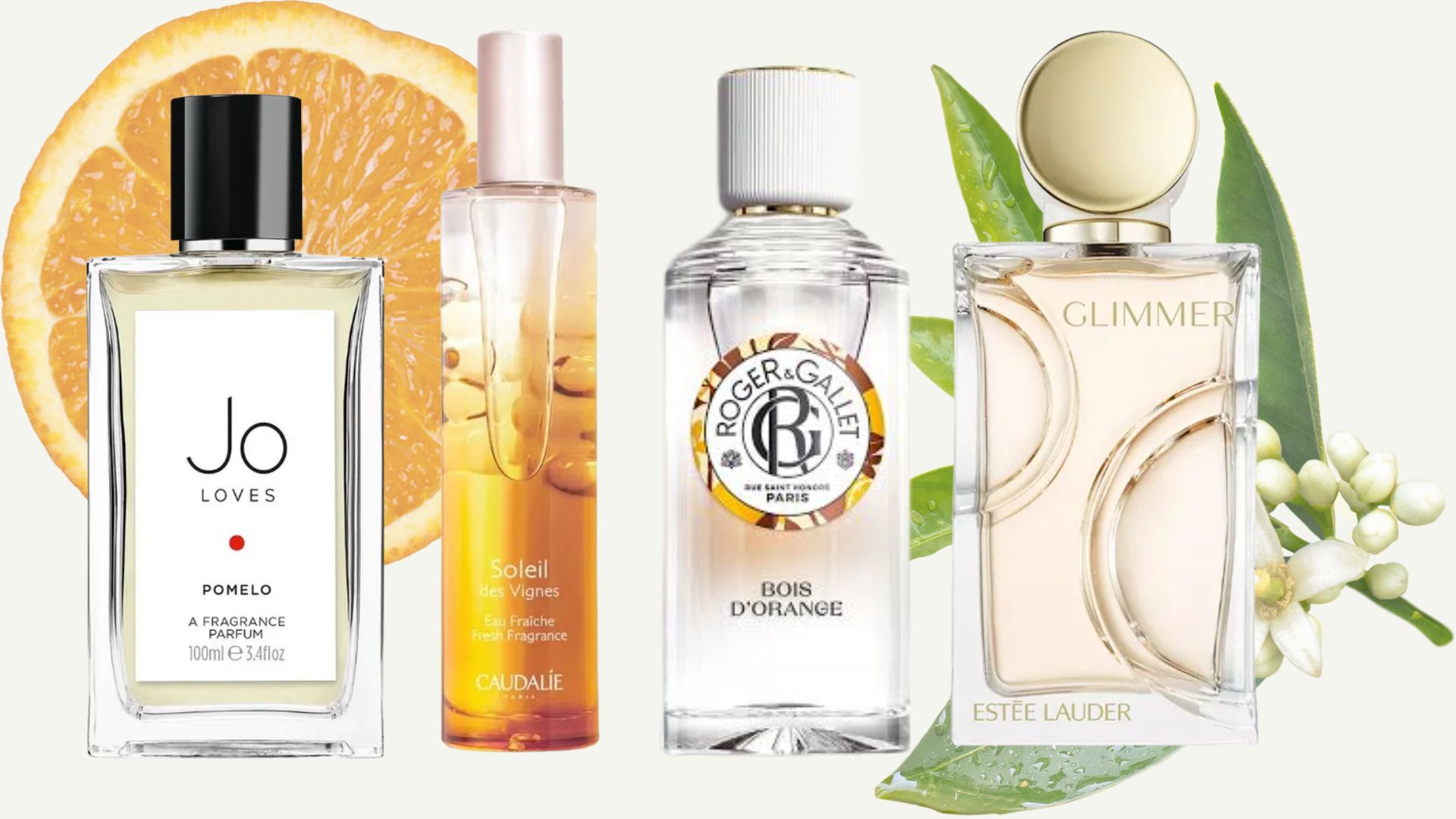 a selection of mood boosting perfume by jo lpoves, caudalie, roger &amp; gallet and estee lauder on a backdrop with an image of an orange and some neroli