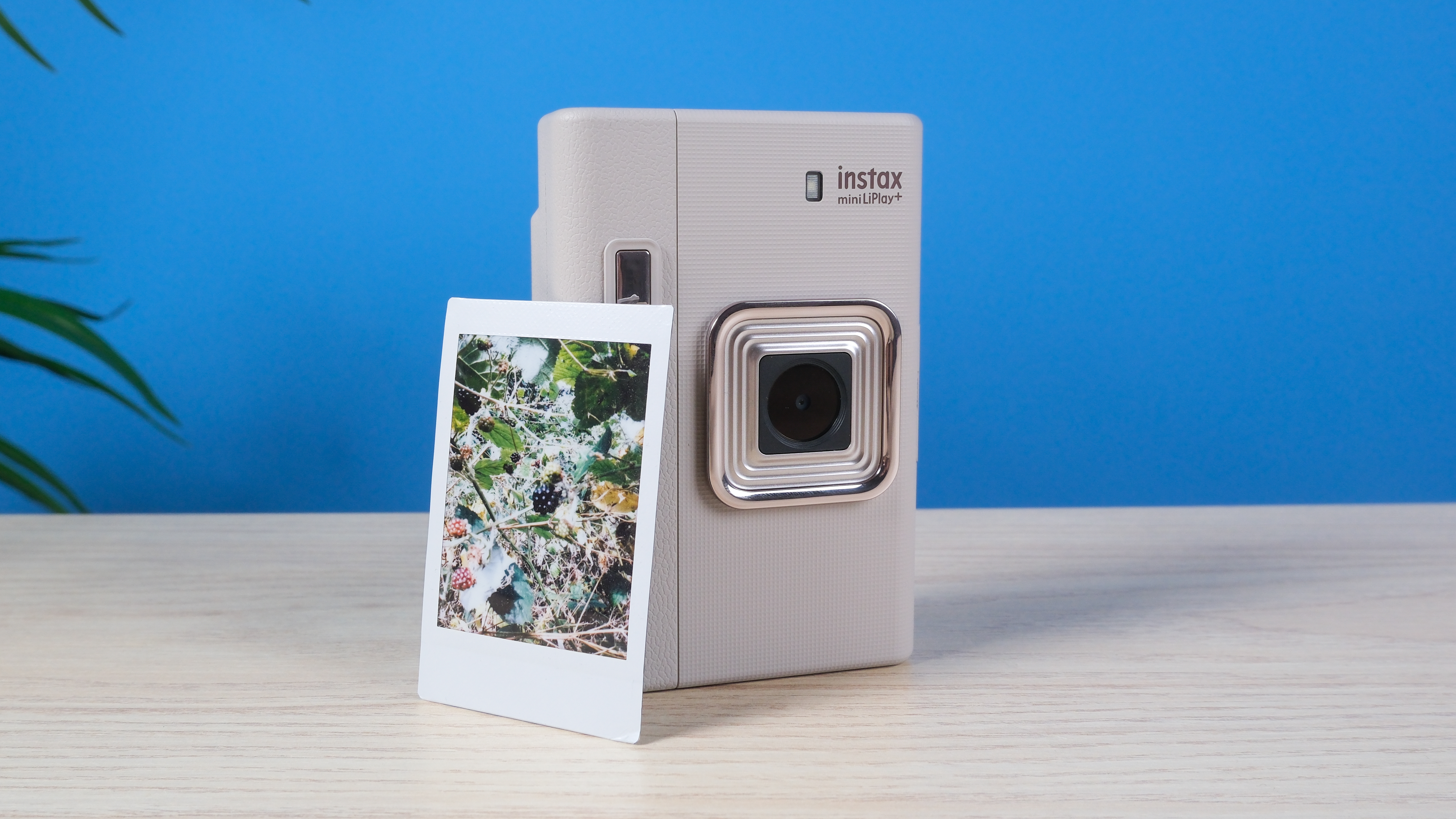 A Sand Beige Fujifilm Instax mini LiPlay Plus hybrid instant camera