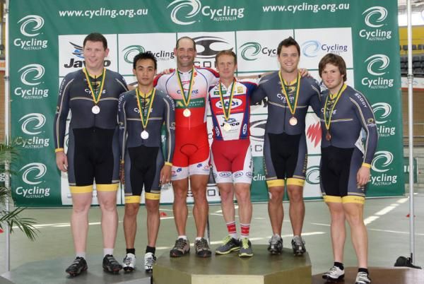 Keirin Modra and pilot David Short celebrate on top of the podium after victory in the Para men's tandem sprint.