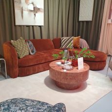 The John Lewis Pleat sofa at the autumn/winter 2025 press preview with a round burl coffee table