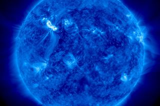 This image from NASA's Solar Dynamics Observatory shows the sun as it unleashed an X5.4-class solar flare at 7:04 p.m. EST on March 6, 2012 (0002 March 7 GMT). The flare appears as the bright spot in the upper left.