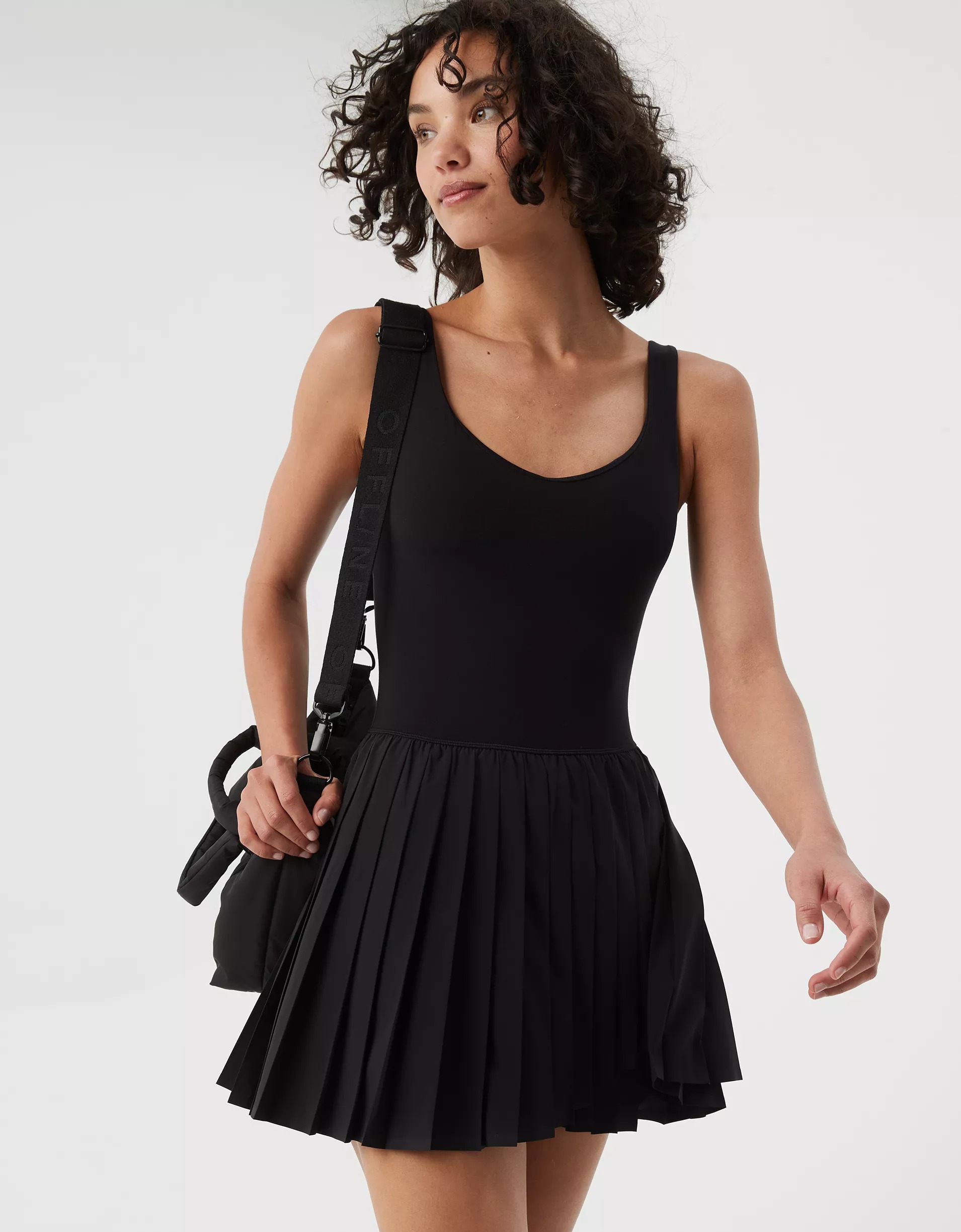 Model wearing black tennis dress