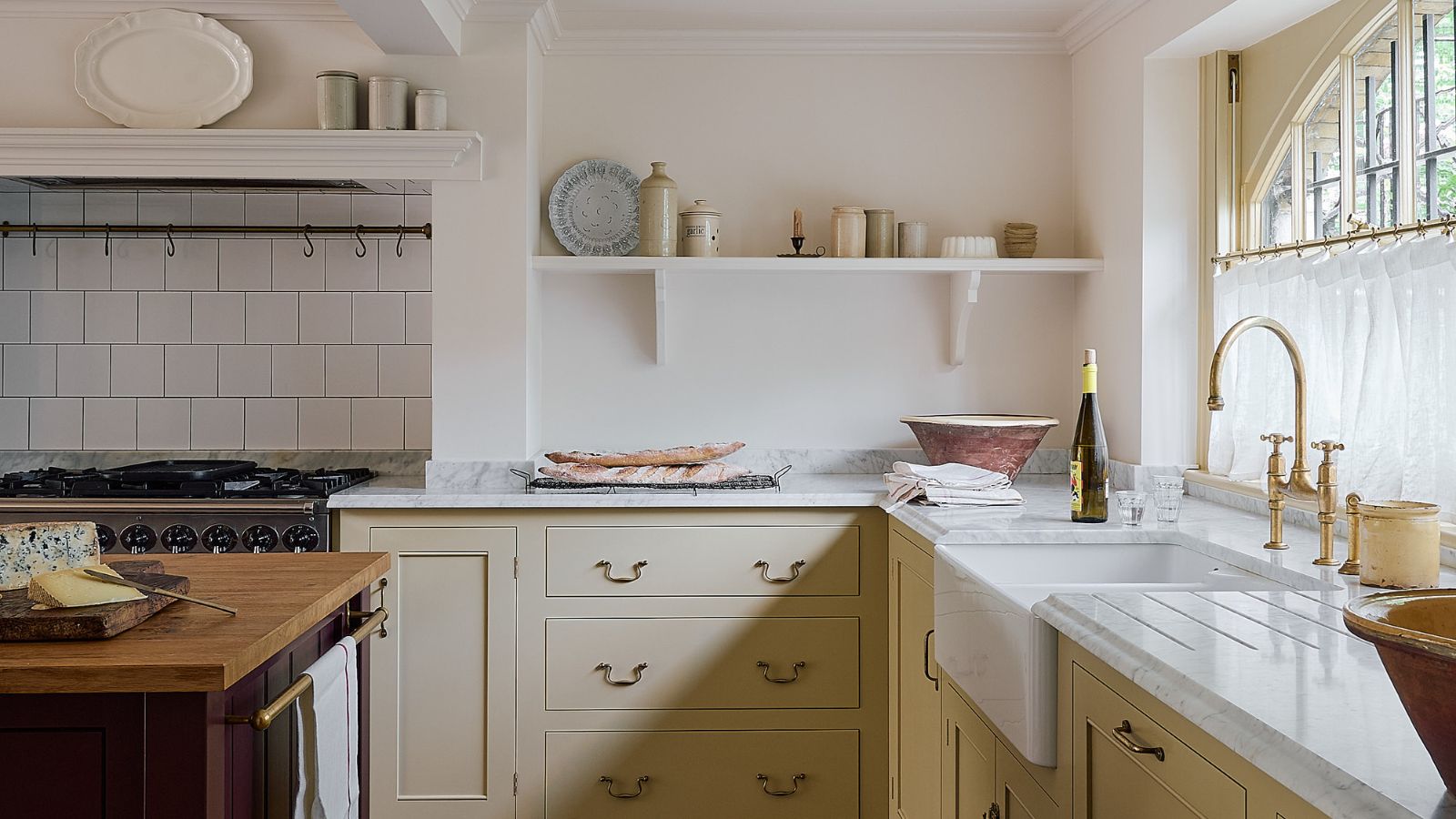 Bright kitchen with range cooker and open shelving