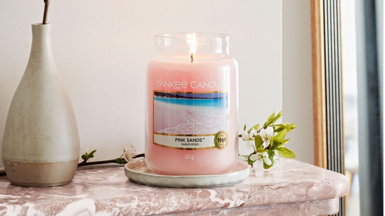 pink sands yankee candle on marble surface