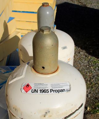 The valve on a propane gas cylinder is protected with a cap