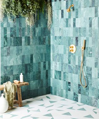 An outdoor shower tile drenched with two different tile designs