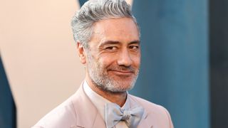 Taika Waititi in a pink suit
